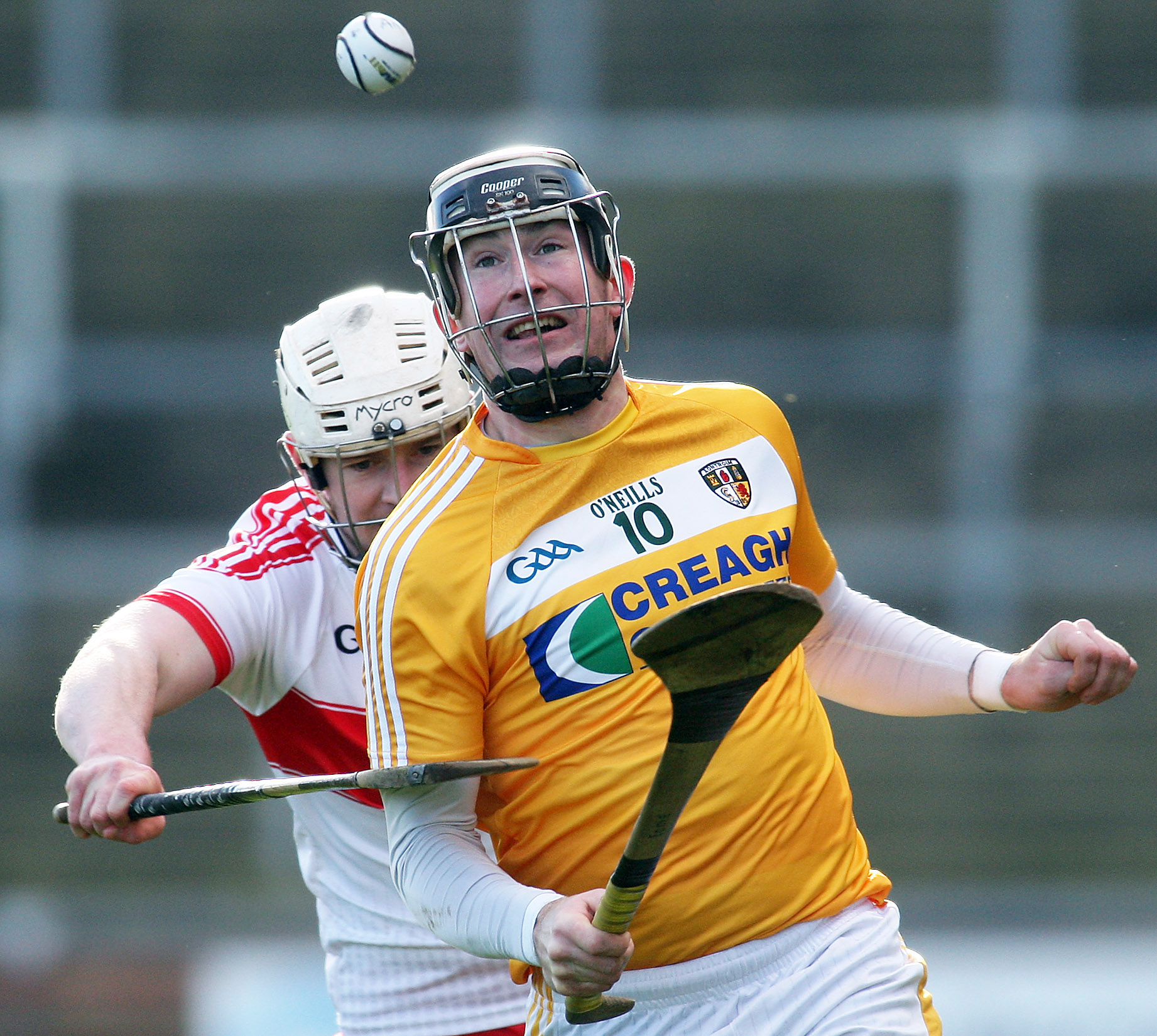 Antrim\'s Eddie McCloskey and Derry\'s Dermot O\'Neill tussle for possession
