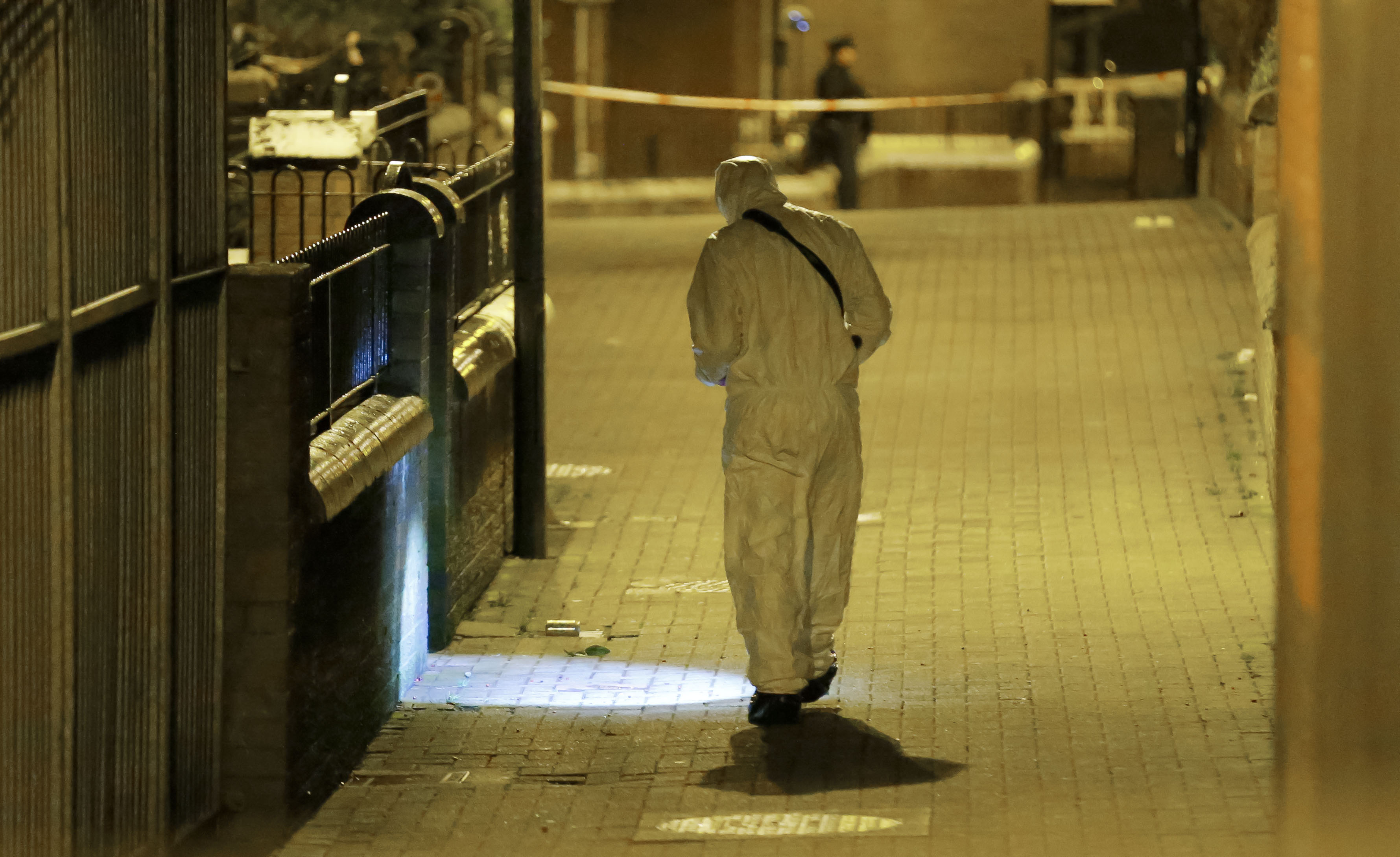 A PSNI forensic officer at the scene of the shooting of Michael McGibbon