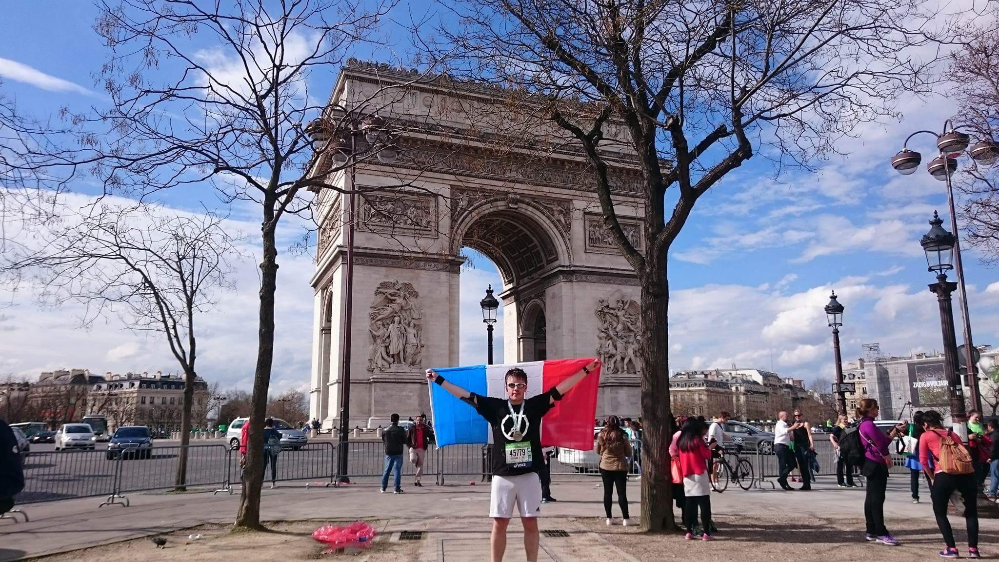 Gerard Moran celebrates finishing the Paris marathon on April 3