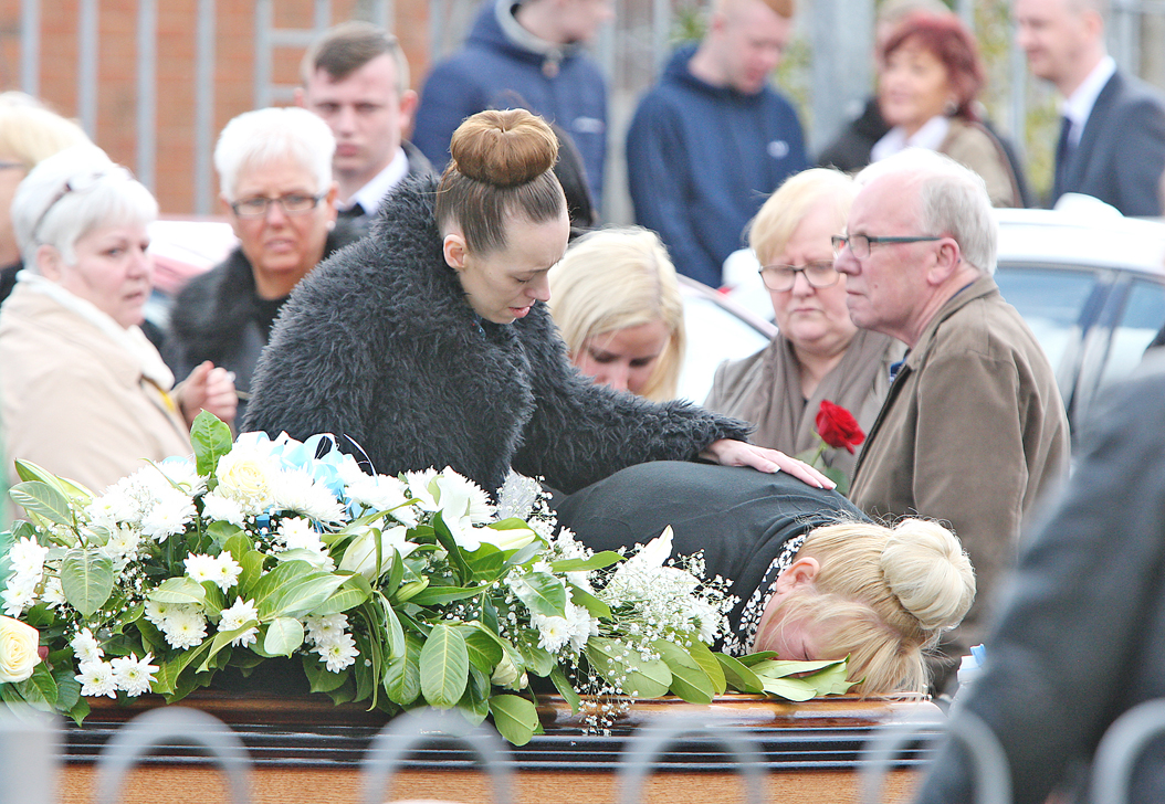 Aaron’s mother Annmarie Strong kisses her son’s coffin as it leaves Corpus Christi Church\n\n