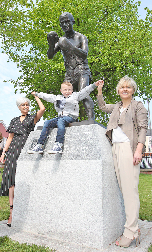 At the unveiling of a statue in Dunville Park of boxer Johnny Caldwell are his daughters Berna McStravick and Patricia Burns and his great grandson Paul 