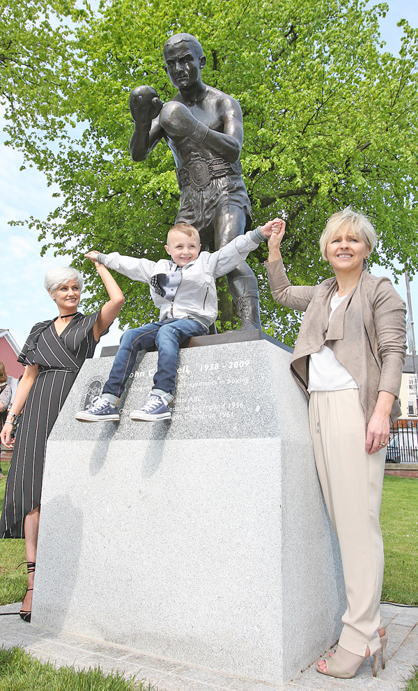 At the unveiling of a statue in Dunville Park of boxer Johnny Caldwell are his daughters Berna McStravick and Patricia Burns and his great grandson Paul
