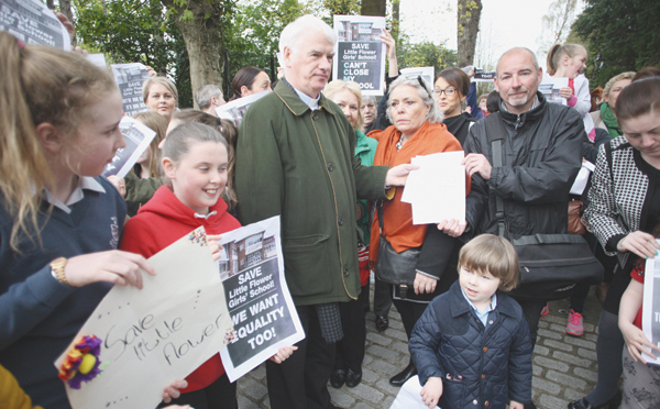 Fra Hughes hands over a letter of protest to Bishop Noel Treanor at his residence on the Somerton Road