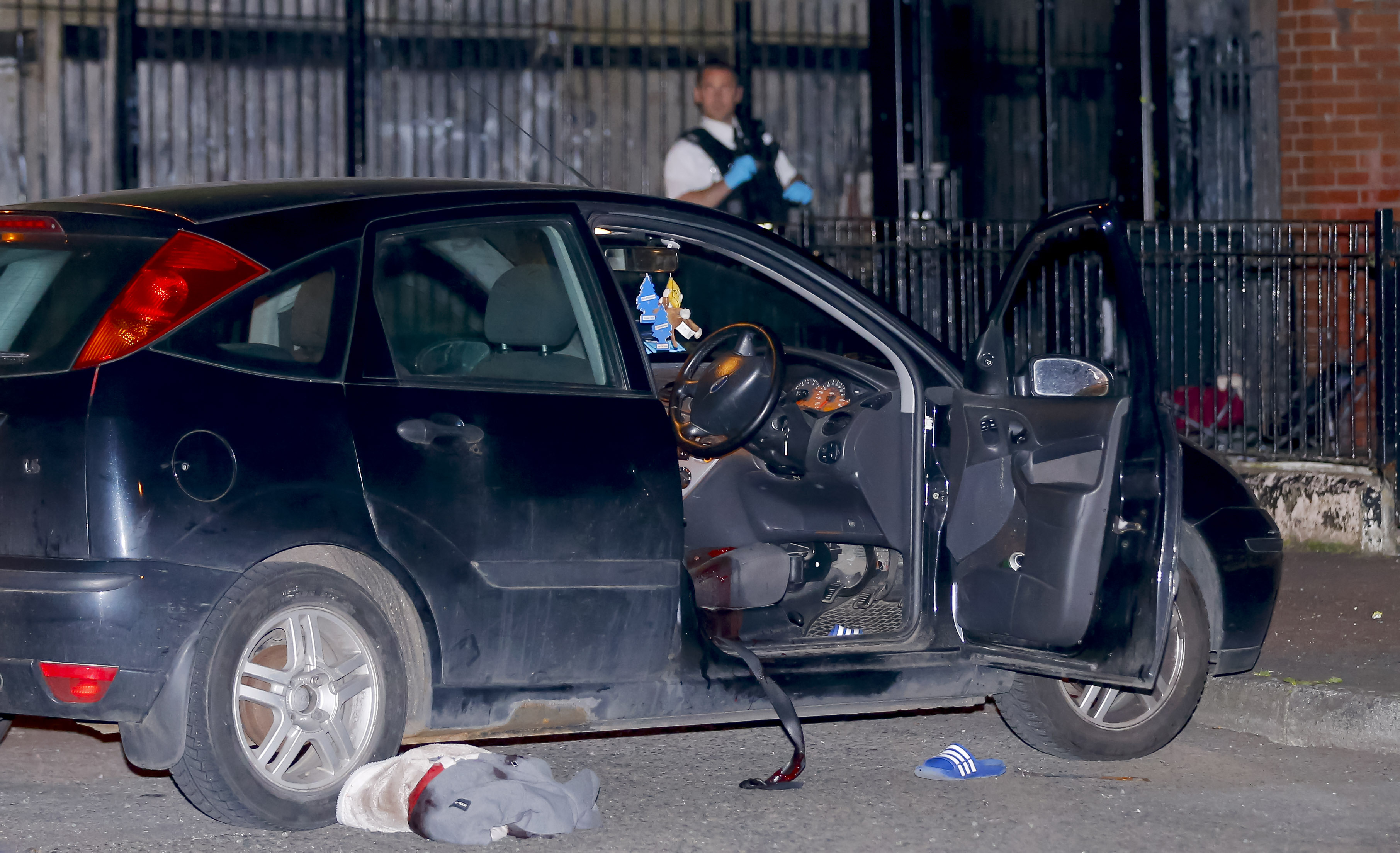 The PSNI and emergency services at the scene in Lady Street where the fatal shooting took place