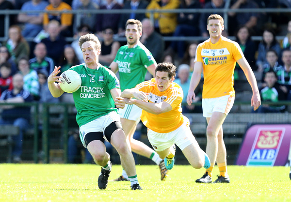 Tomás Corrigan of Fermanagh gets away from the challenge of Kevin O’Boyle