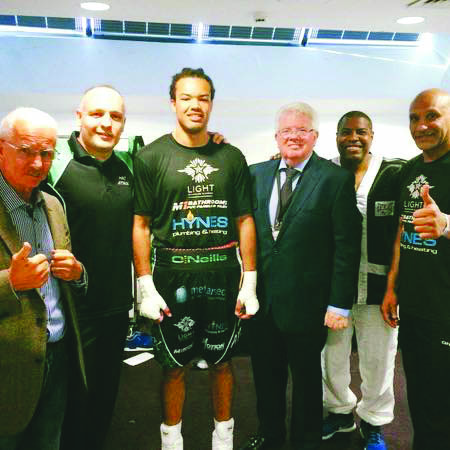 Tommy McCarthy with coach, Brian Magee and his team after Saturday’s impressive win against Jon-Lewis Dickenson in Glasgow to move him to the brink of a British cruiserweight title shot