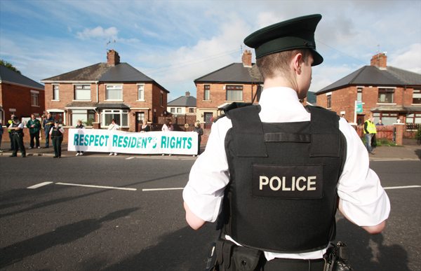 Residents protest at the annual Orange Order parade past nationalist homes on the Crumlin Road
