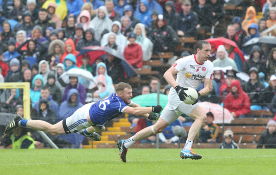 Tyrone\'s Colm Cavanagh breaks away from Cavan\'s James McEnroe during their drawn Ulster SFC semi-final. The Red Hands can beat the minus three-point handicap at Evens this Sunday at Clones