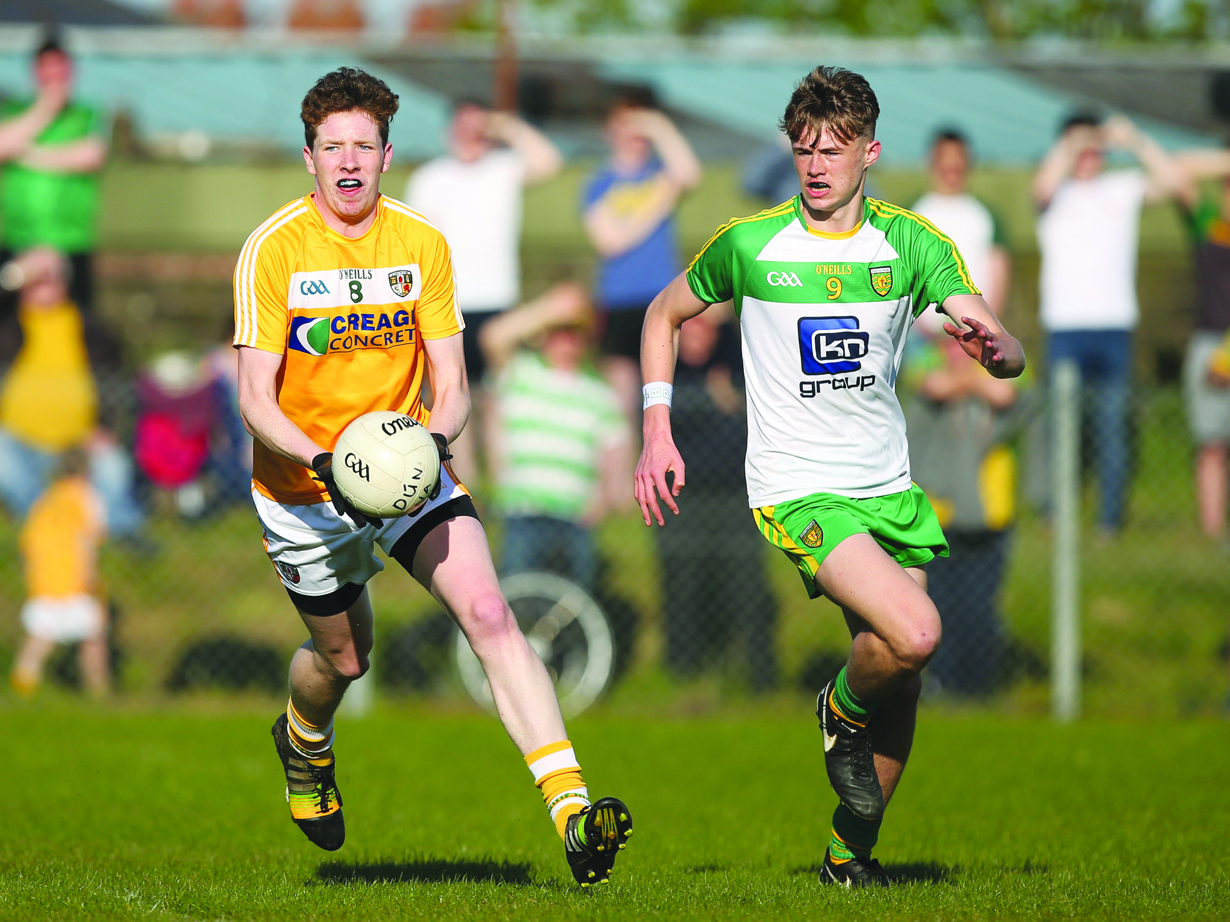 Niall McKeown looks to avoid the attention of Donegal’s Kieran Gallagher on Sunday evening