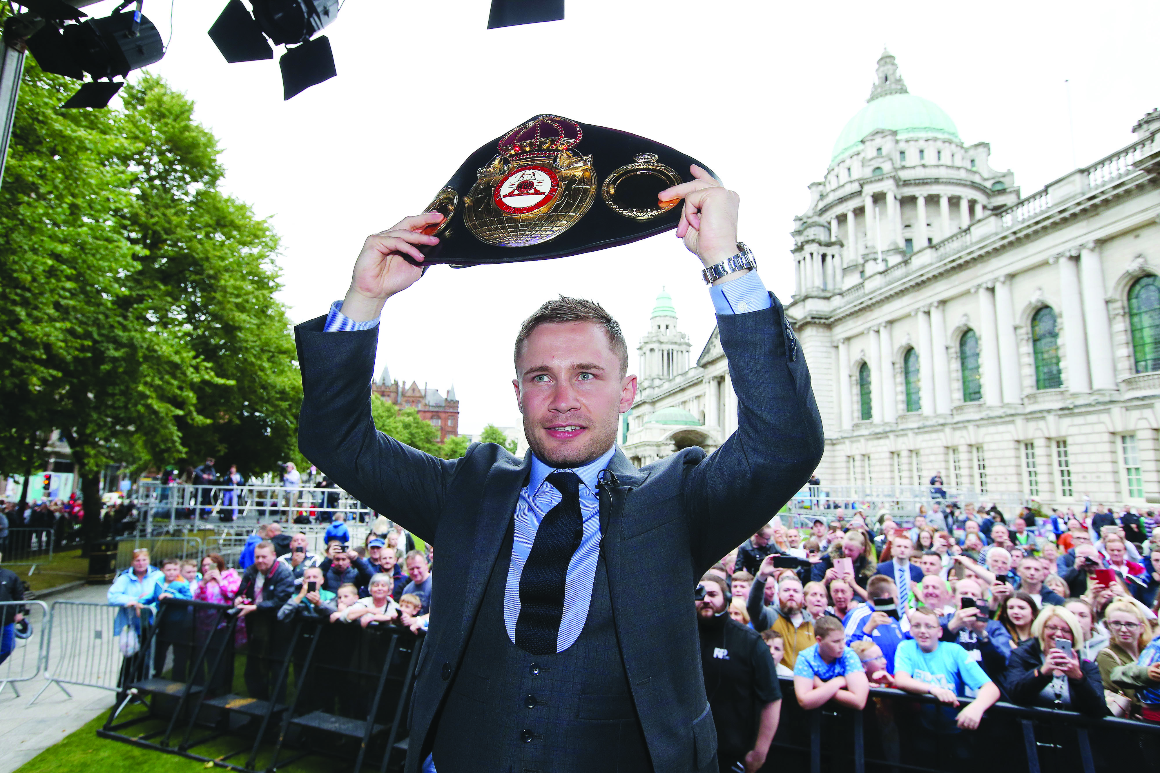 Carl Frampton shows off the WBA featherweight title belt he won in New York on July 30