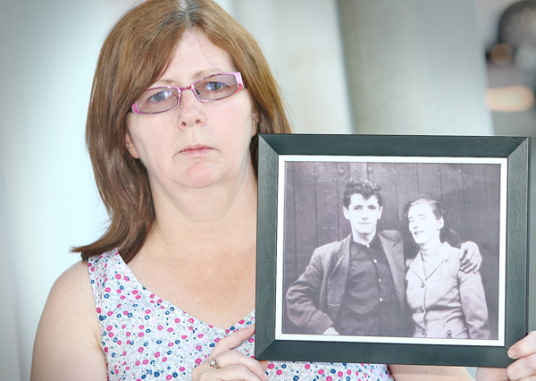 REUNITED: Janet Donnelly with a treasured portrait of her mum and dad, Joseph and Mary. The double burial today will be a bittersweet affair for the family