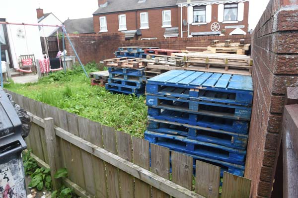The pallets stored in an Oldpark garden have now been removed