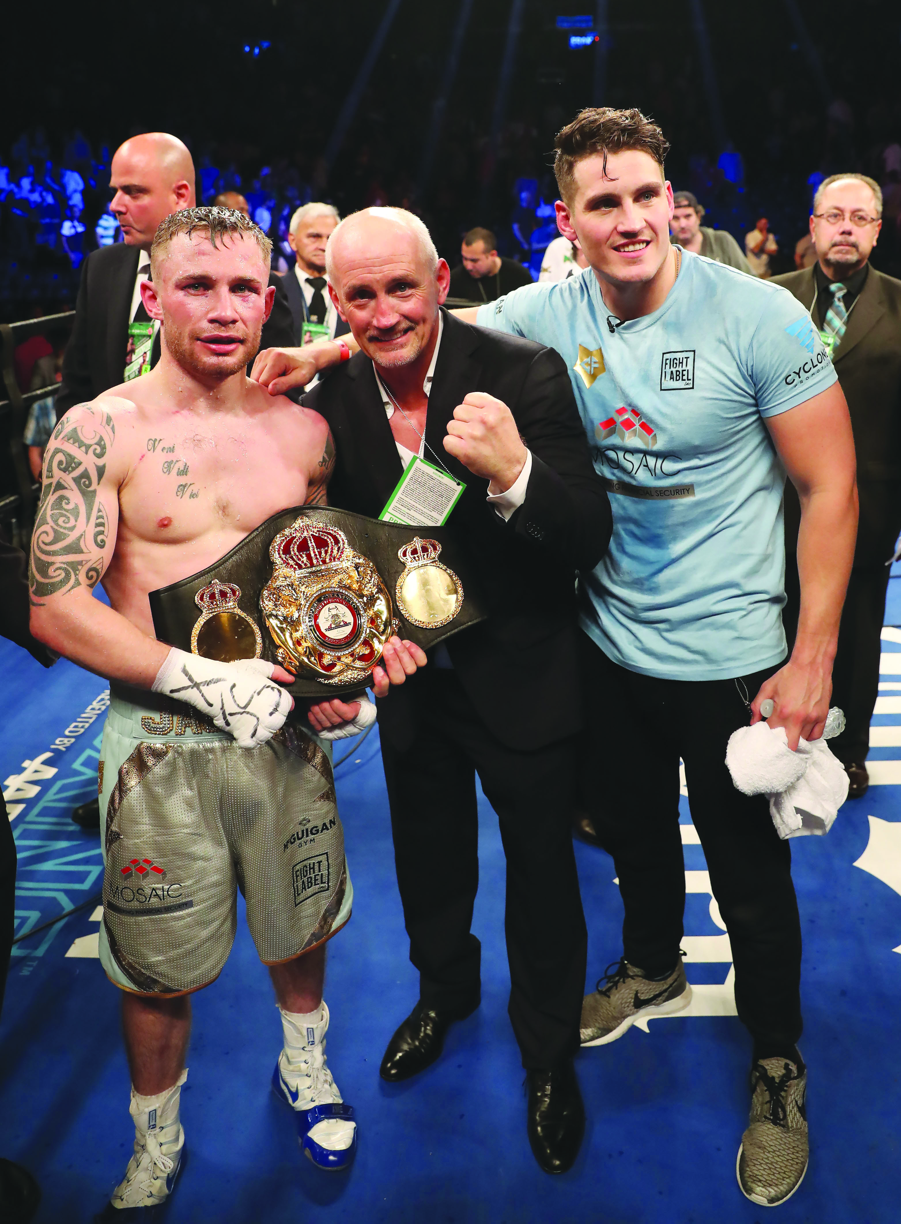Carl Frampton, Barry McGuigan and Shane McGuigan pose with the WBA featherweight title belt after ‘The Jackal’ made history by becoming the first two-weight world champion from the North in Brooklyn on Saturday night
