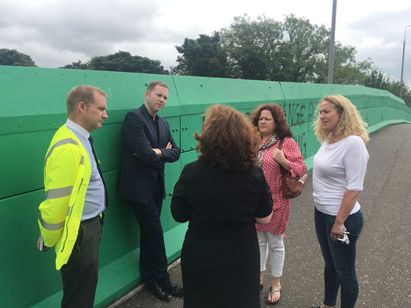 Minister Chris Hazzard visited Finaghy Bridge to hear for himself the thoughts of local representatives and residents