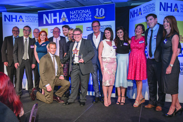 Newington Housing Association celebrate their award at the National Housing Awards 2016 in London with host Alexander Armstrong \n\n