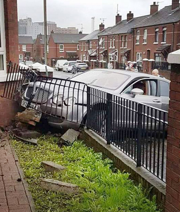 The Silver Bentley smashed into the garden wall of a house in West Belfast on Saturday afternoon.