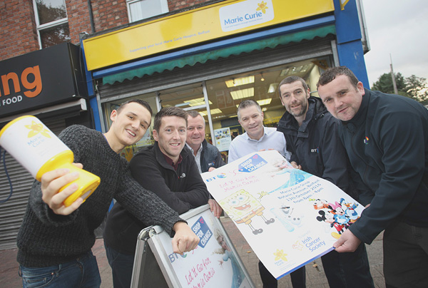 Paul Cunningham and Jamie Holland of the Marie Curie Charity Shop in Botanic Ave with Ray McDonnell, James Nolan, Chris Collins and John Breen of BT
