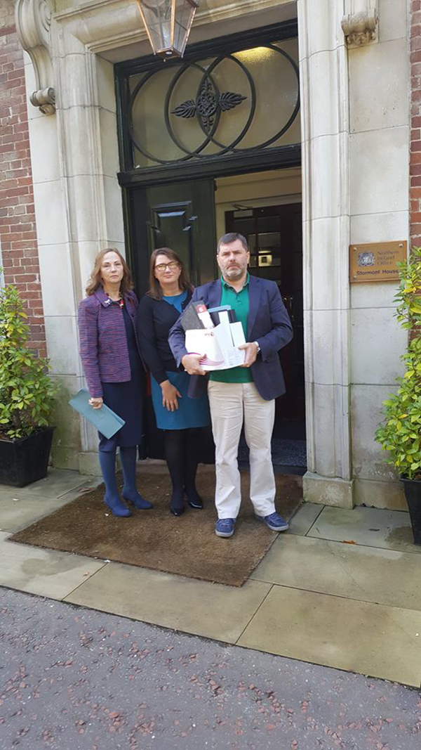 Carmel Quinn, Andrée Murphy and Mark Thompson with RFJ’s collusion report, the de Silva review of the murder of Pat Finucane, John Stevens’ third report on collusion and the Cory reports on collusion, which they presented to the British Secretary of State\n\n