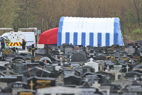 The scene in Milltown Cemetery on Monday as the exhumation of the body of Daniel Rooney began