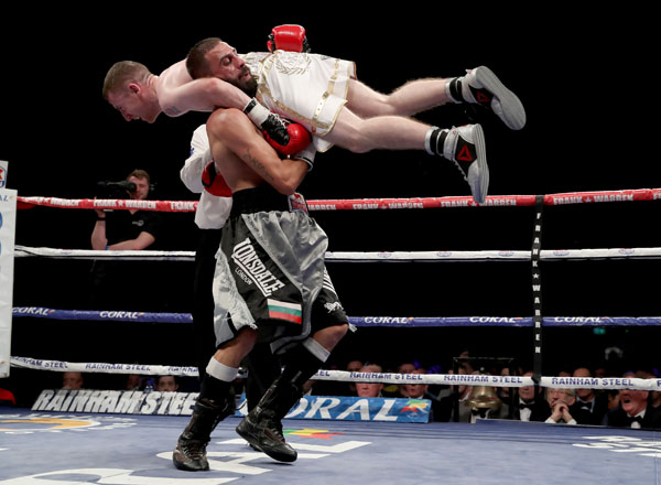 Paddy Barnes is lifted by opponent Stefan Slachev during their flyweight bout at Belfast’s Titanic Exhibition Centre on Saturday night. The Hungarian was subsequently disqualified by referee Hugh Russell Jnr