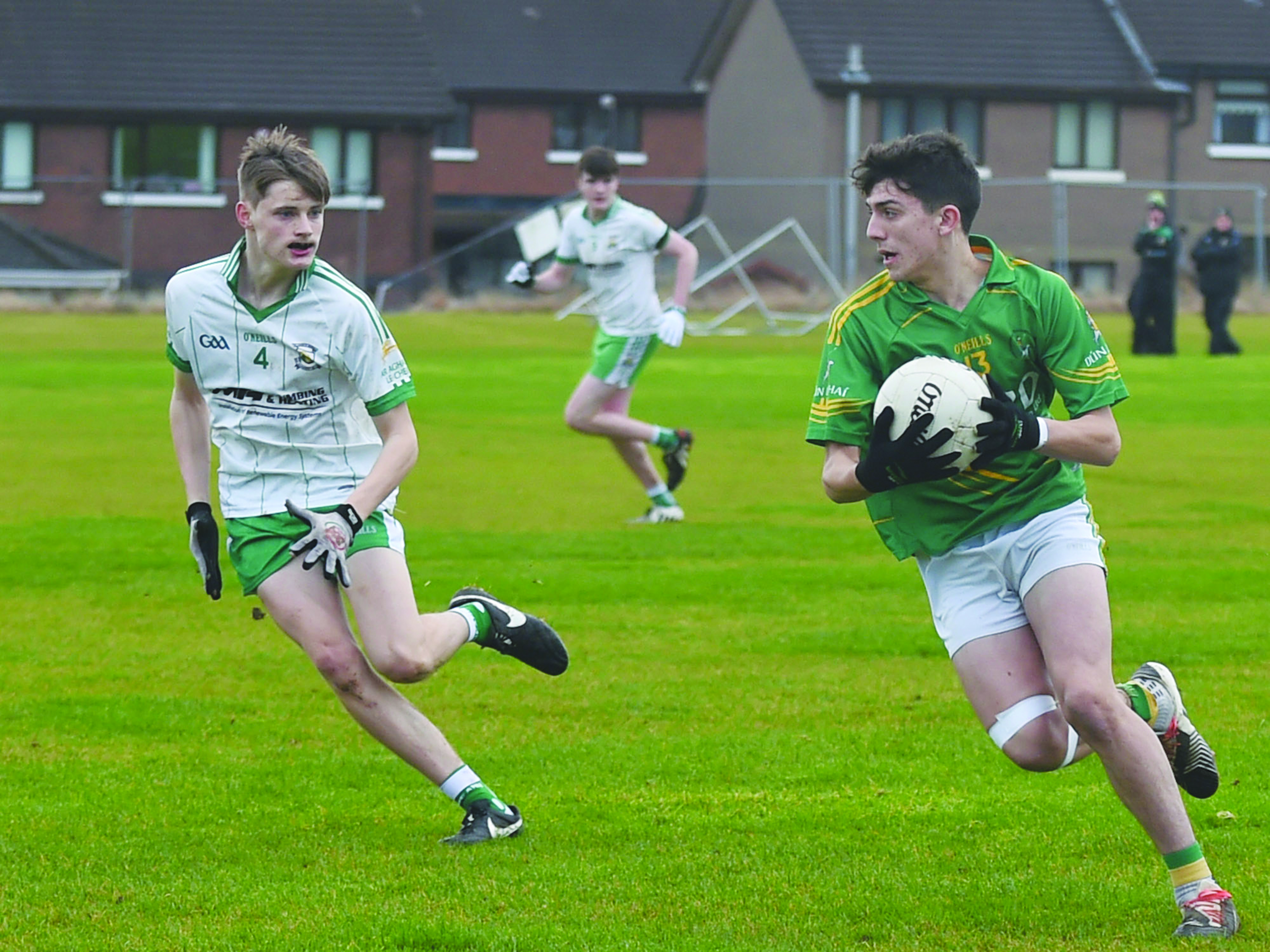 Sean Elliott goes on the attack for Dunloy as Ardan McAvoy looks on