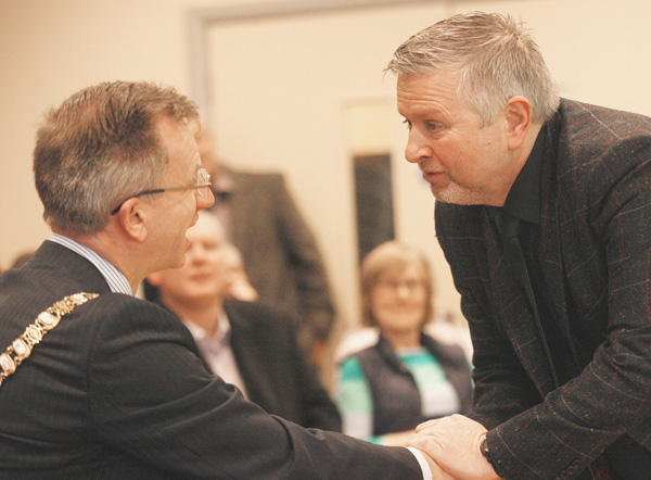 Fr Gary Donegan with DUP Mayor Brian Kingston at the Houben Centre