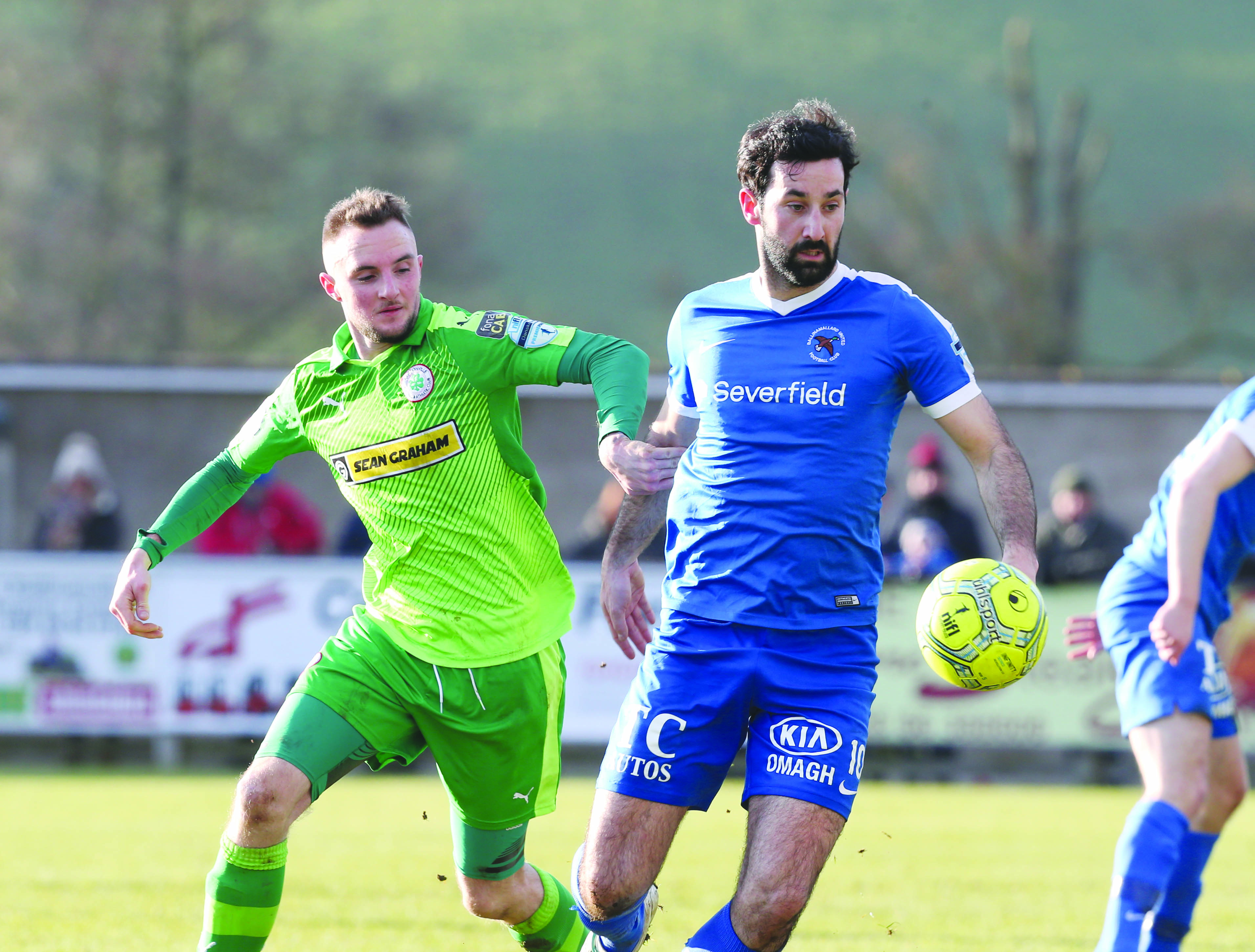 Jude Winchester, pictured in action against Ballinamallard’s Johnny Lafferty during last Saturday’s 1-0 defeat at Ferney Park, will miss Cliftonville’s home clash with Glentoran tomorrow night (Friday) through injury