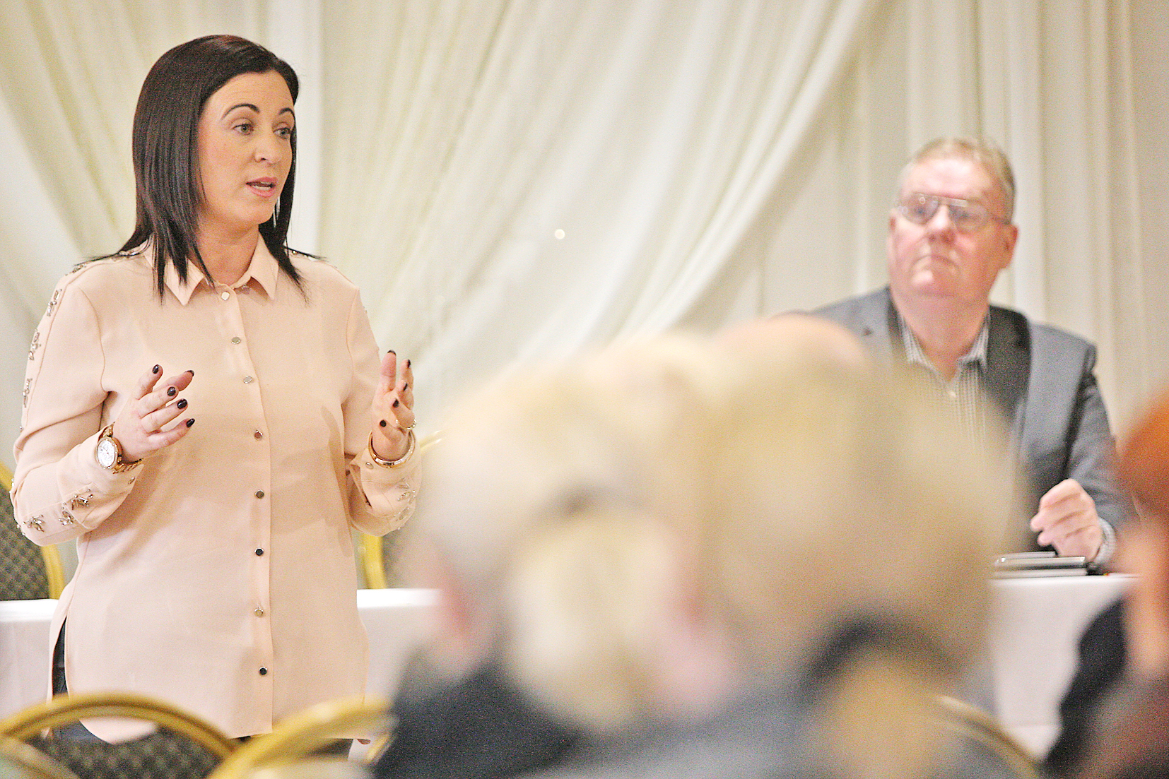 Julieann McNally in the Balmoral Hotel during a public meeting on Dunmurry Manor