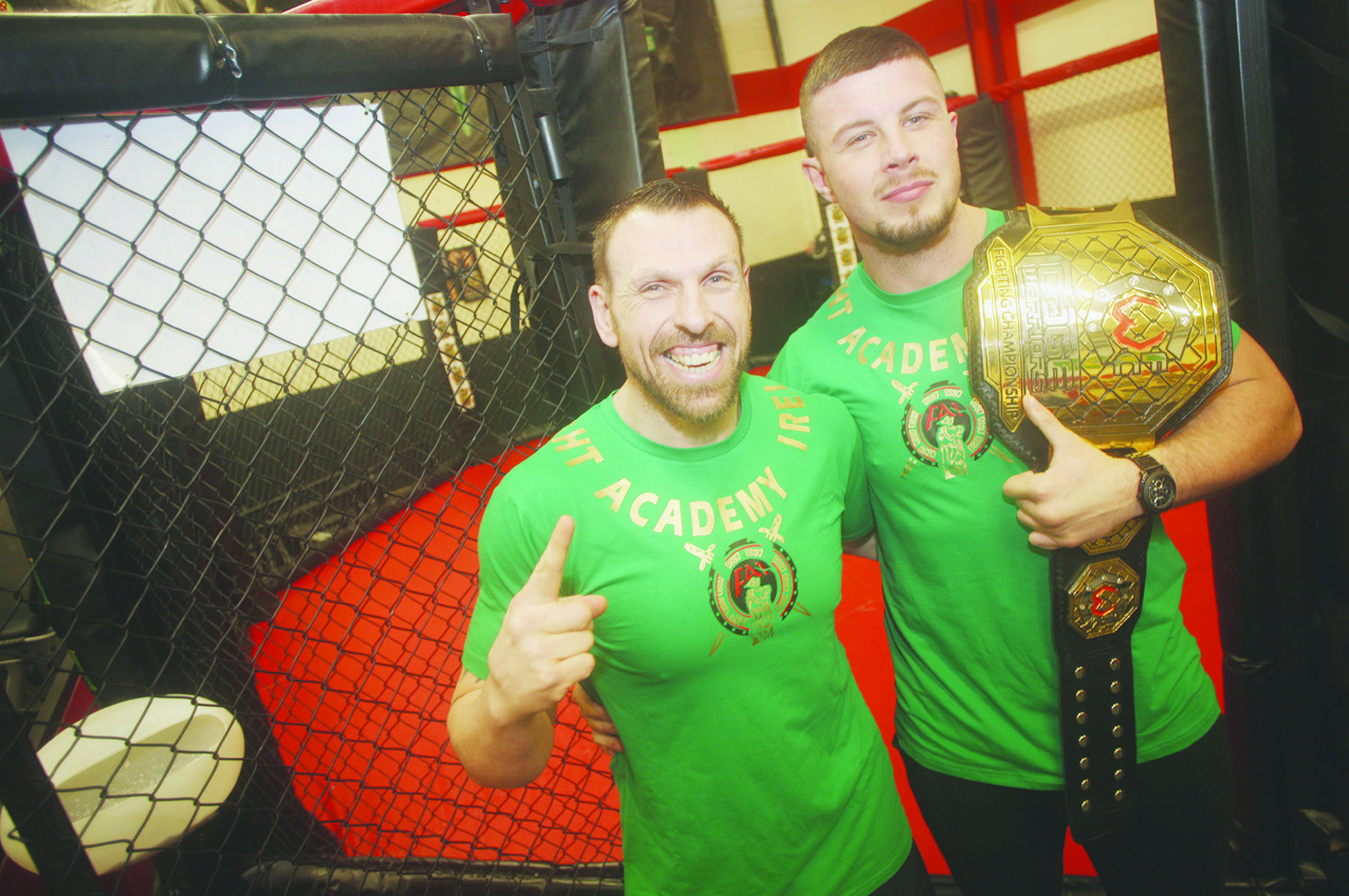 Cage Warrior light-heavyweight World Champion Karl Moore with his title belt alongside his coach Liam Shannon at Belfast’s Fight Academy MMA gym. Shannon believes his fighter has the talent to make it in the UFC 