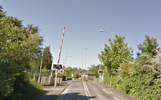 Youths were seen running across the train tracks at Dunmurry on Thursday evening