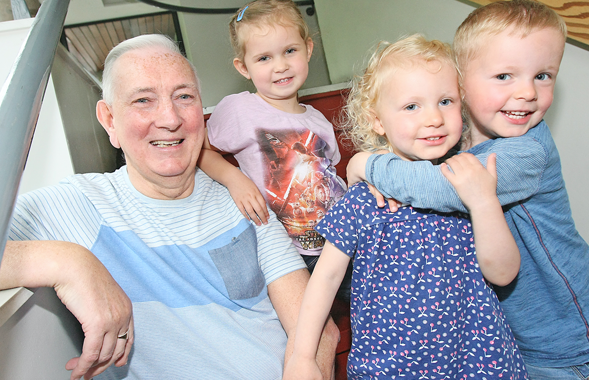 Ray Megahey with his grandchildren