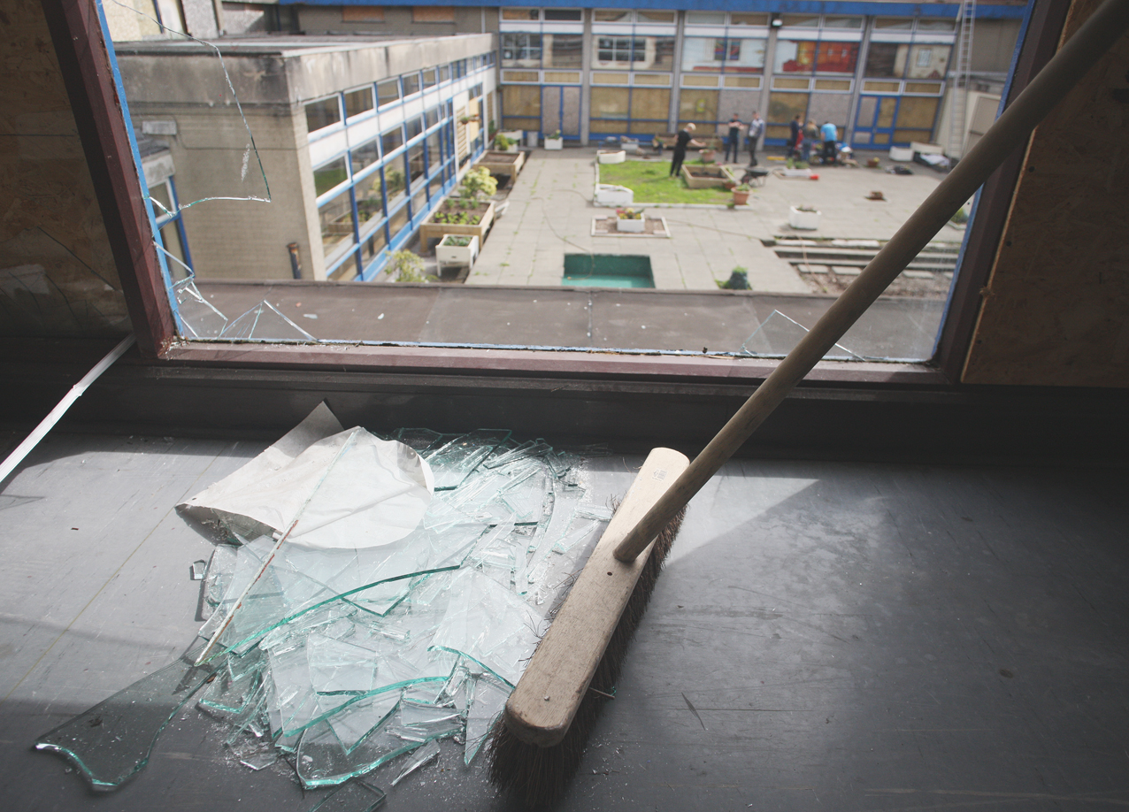 DISGRACE: The clean-up begins at the old St Gemma’s School after it was vandalised once more