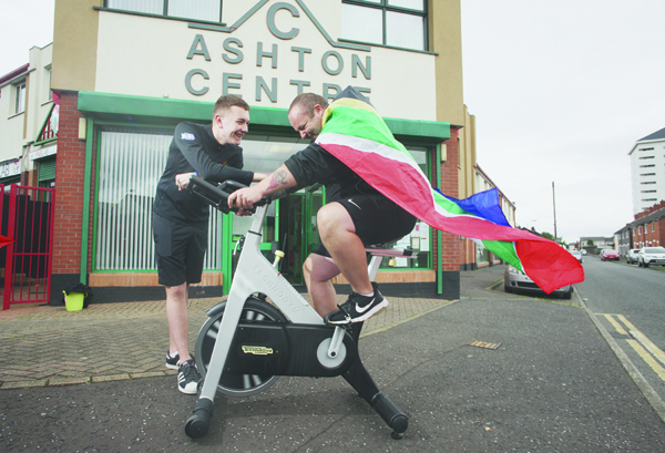 Youth leader Paddy Doyle and Conor McAuley from New Lodge Youth Centre gear up for their sponsored spin cycle