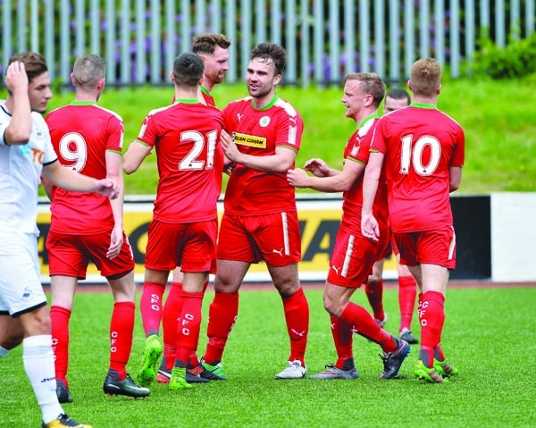 Cliftonville players celebrate Garry Breen’s goal against Swansea U23s on Saturday