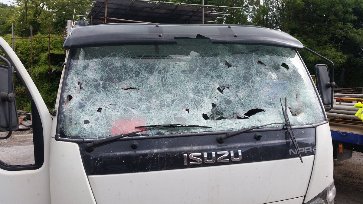 MINDLESS: One of the three vans badly damaged in the attack
