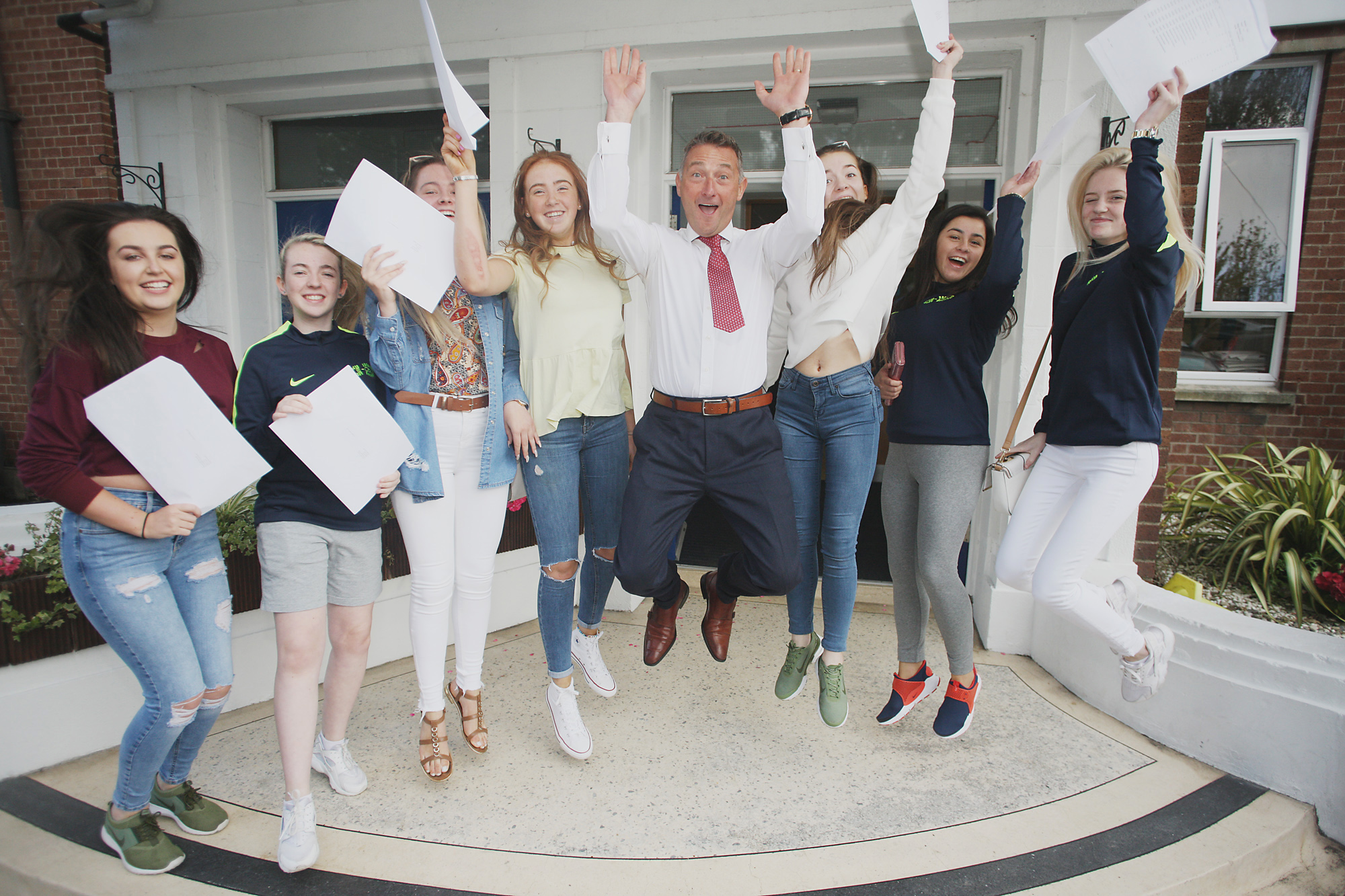 Head Teacher Martin Moreland celabreating GCSE results with Mercy College girls