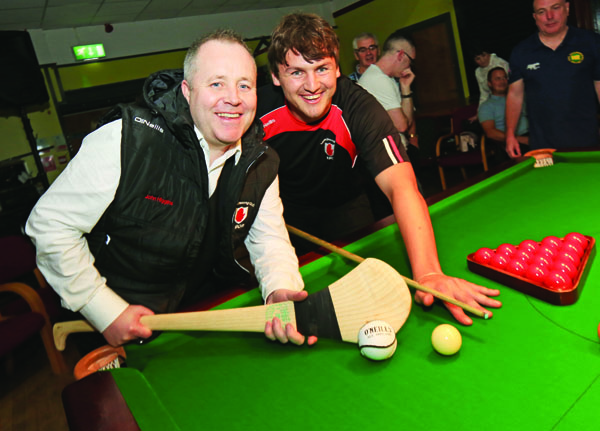 John Higgins swaps his snooker cue for a hurling stick with Lámh Dhearg senior, Domhnall Nugent