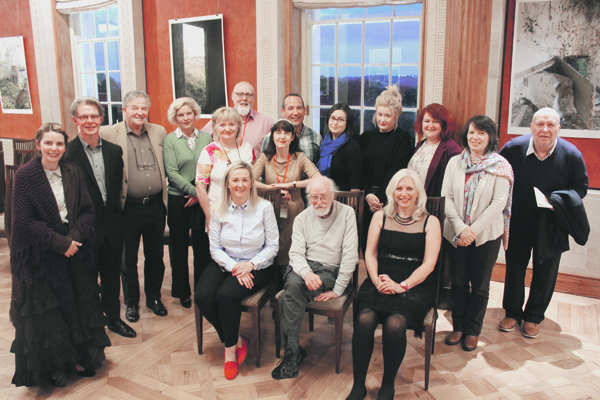 TOGETHER: Guests join Lise McGreevy, centre middle, at her cultural equality exhibition launch, Abandoned; Not Forgotten? at Stormont