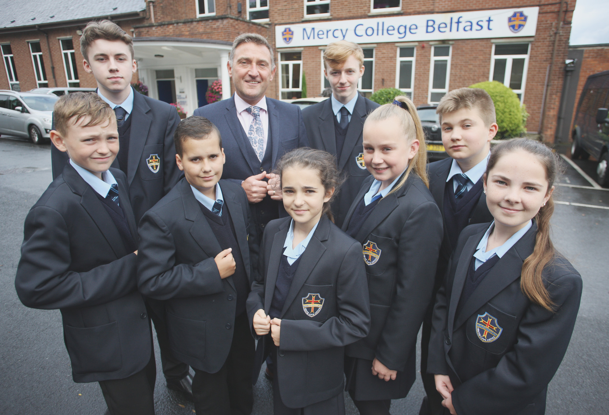 LOOKING TO THE FUTURE: Principal Martin Moreland with Mercy College boys and girls getting used to being part of a co-ed school