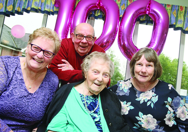 Minnie Wilson celebrates her 100th birthday  in Abingdon Manor Care pictured with her son and daughter, Allan and Margaret and friend Lydia McRoberts (right)