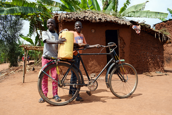 ORPHANED: Brothers  Jean Nshimirimana and Clovis Kwizerimana faced adversity after the death of their parents – a new home and a bicycle courtesy of Concern have given them the hope of better future
