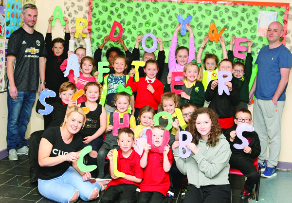 Ardoyne After-Schools Club children with staff members Damien Sparks, Paul Toner, Leanne Faulkner and Jessica Flynn