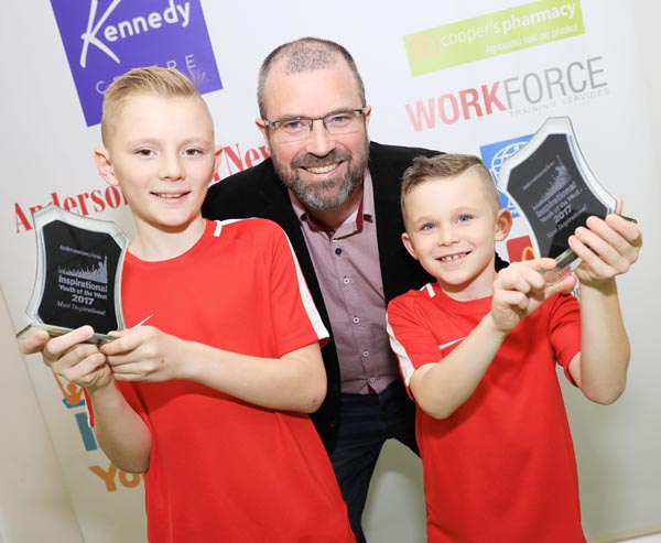 Tom and Martin McIlwaine, winners of the Most Inspirational Youth award, with John Jones of event premier sponsors the Kennedy Centre