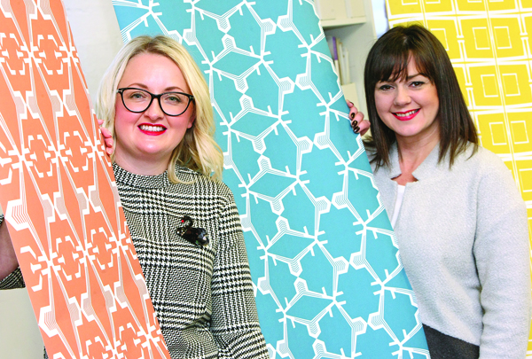 Martina Shields and Nicola McArea of MANI Interior Design with their wallpaper based on the Harland & Wolff cranes; left, at their Conway Mill studios