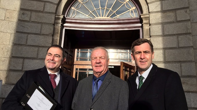  Raymond outside the Four Courts in Dublin with his legal team from McIvor Farrell