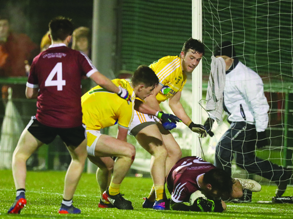 Paddy McAleer’s late goal chance is smothered on the ground by Paul McAtamney \nPic by John McIlwaine