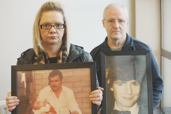 QUESTIONS: Lisa McNally with a photo of her father Gerard Clarke, and Chris Moran holding a photo of his brother John Moran