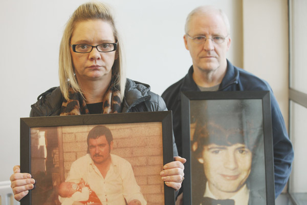 QUESTIONS: Lisa McNally with a photo of her father Gerard Clarke, and Chris Moran holding a photo of his brother John Moran