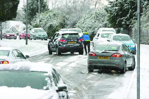 Snow and ice causing problems for motorists in Lagmore Avenue in West Belfast