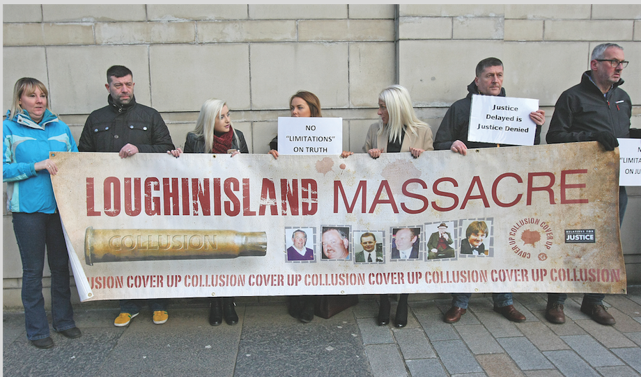 Supporters of those killed in the Loughinisland massacre gather outside Belfast High Court 